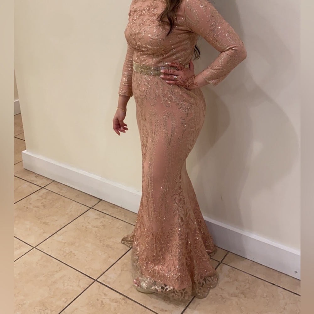 A pink glittery silver belt dress